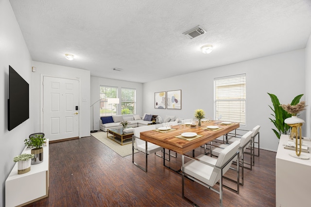 19130 Yaupon Ranch Dr, Cypress, TX 77433 - dining room with a textured ceiling and wood finished floors