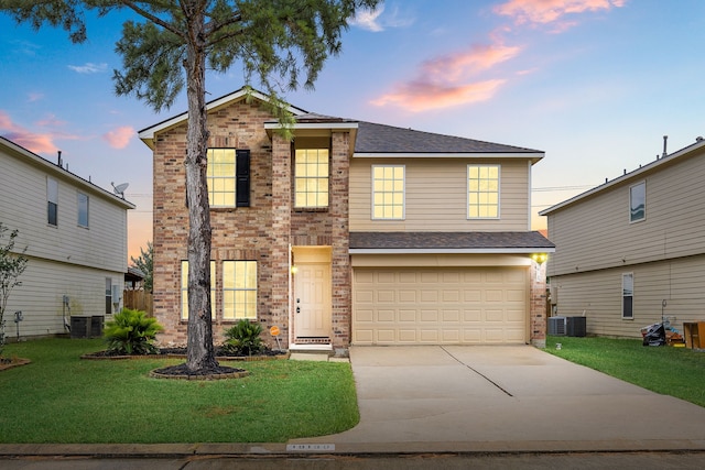 19130 Yaupon Ranch Dr, Cypress, TX 77433 - traditional-style home featuring brick siding, driveway, a lawn, and a garage