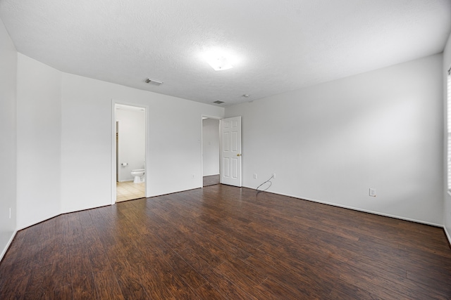 19130 Yaupon Ranch Dr, Cypress, TX 77433 - unfurnished room with wood finished floors, a textured ceiling, and baseboards