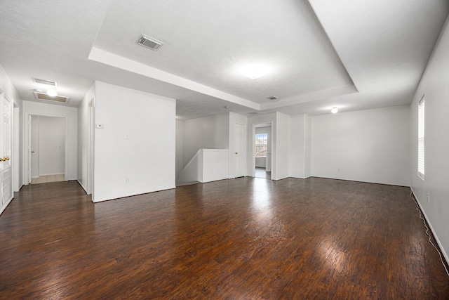 19130 Yaupon Ranch Dr, Cypress, TX 77433 - unfurnished room featuring a tray ceiling and dark wood-style flooring
