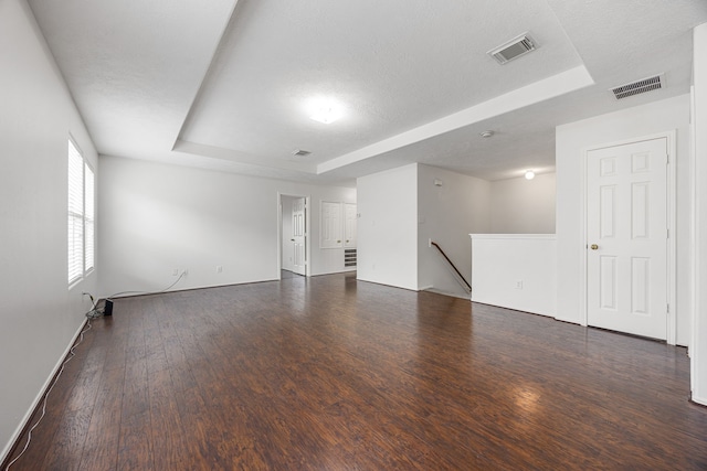 19130 Yaupon Ranch Dr, Cypress, TX 77433 - spare room featuring a tray ceiling, wood finished floors, and baseboards