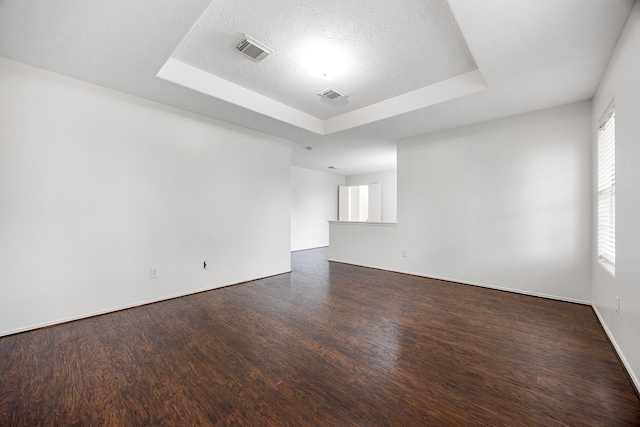 19130 Yaupon Ranch Dr, Cypress, TX 77433 - spare room with a tray ceiling, wood finished floors, and baseboards