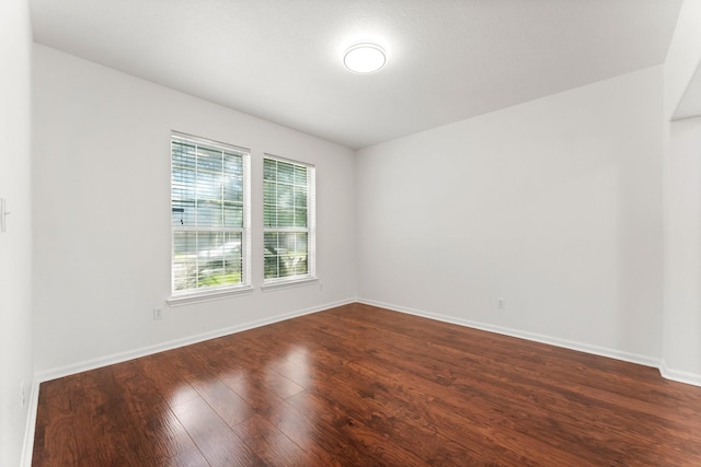 235 Doncaster St, Conroe, TX 77303 - spare room featuring dark wood finished floors and baseboards