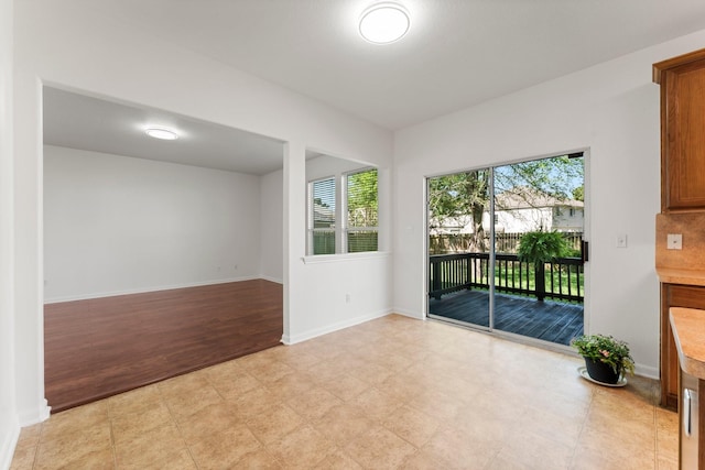 235 Doncaster St, Conroe, TX 77303 - spare room featuring light flooring and baseboards