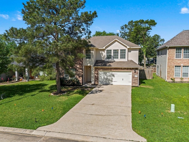 235 Doncaster St, Conroe, TX 77303 - view of front of house featuring driveway, a garage, a front yard, and brick siding