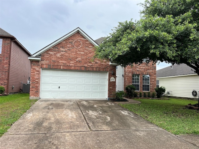 20314 Paso Fino Dr, Humble, TX 77338 - view of front of home featuring brick siding, driveway, a front lawn, and central AC