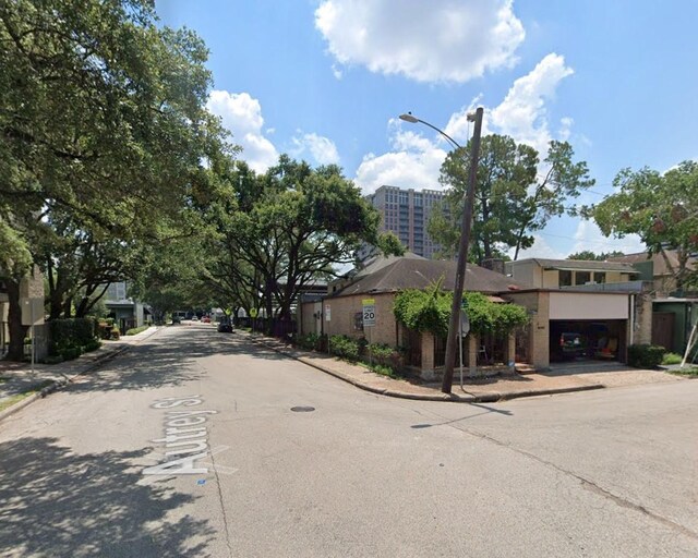 4703 Yoakum Blvd, Houston, TX 77006 - view of asphalt road with sidewalks, curbs, and street lights