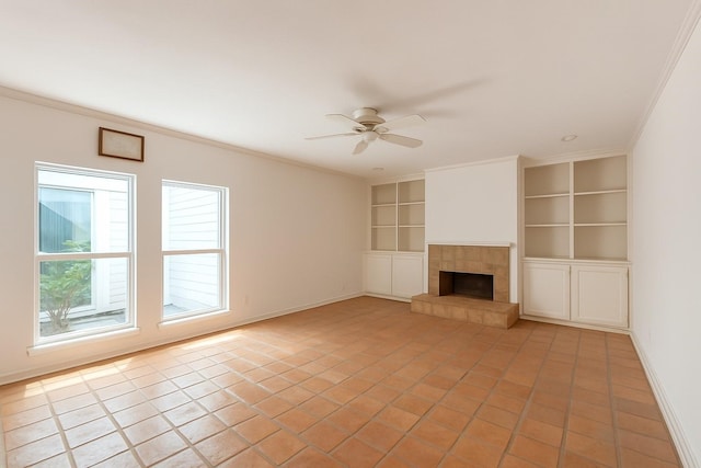 4703 Yoakum Blvd, Houston, TX 77006 - unfurnished living room featuring built in features, a ceiling fan, ornamental molding, light tile patterned flooring, and a tile fireplace