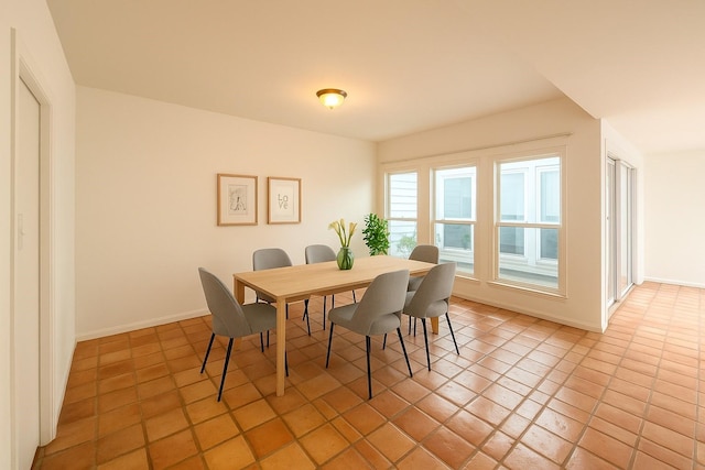 4703 Yoakum Blvd, Houston, TX 77006 - dining area with light tile patterned flooring and baseboards