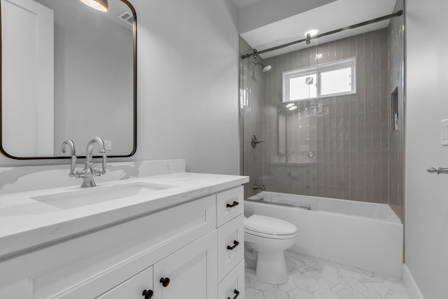 501 Avondale St, Houston, TX 77006 - bathroom featuring vanity, toilet, shower / bath combination, and marble finish floors