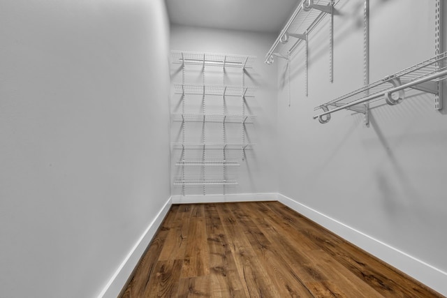 501 Avondale St, Houston, TX 77006 - walk in closet with dark wood-style floors