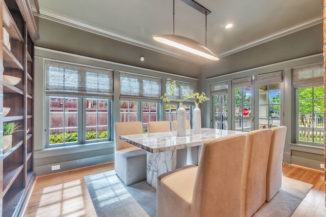 501 Avondale St, Houston, TX 77006 - dining area with crown molding, light wood-type flooring, and recessed lighting