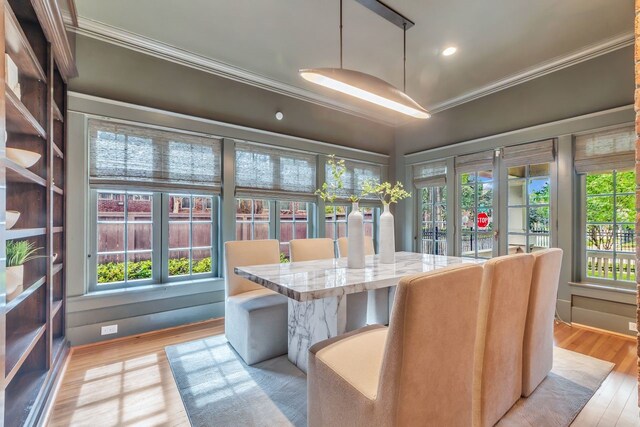 501 Avondale St, Houston, TX 77006 - dining space featuring crown molding, light wood-type flooring, and recessed lighting