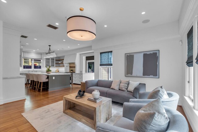 501 Avondale St, Houston, TX 77006 - living area with healthy amount of natural light, light wood-style flooring, and recessed lighting