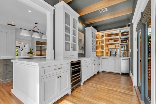 501 Avondale St, Houston, TX 77006 - bar with beverage cooler, recessed lighting, light wood-style flooring, and pendant lighting