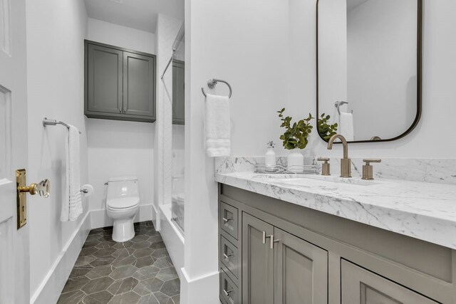 501 Avondale St, Houston, TX 77006 - bathroom featuring vanity,  shower combination, and toilet