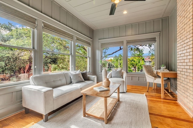 501 Avondale St, Houston, TX 77006 - sunroom / solarium with wood finished floors, a decorative wall, and brick wall