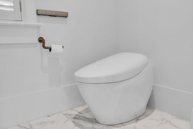 501 Avondale St, Houston, TX 77006 - full bath featuring marble look tile flooring and a bath