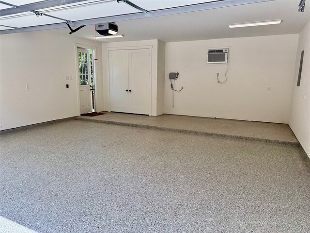 501 Avondale St, Houston, TX 77006 - garage with an AC wall unit and a garage door opener