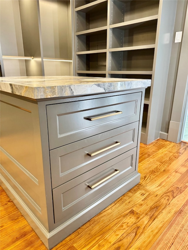 501 Avondale St, Houston, TX 77006 - detailed view of gray cabinetry, light countertops, and light wood-style floors