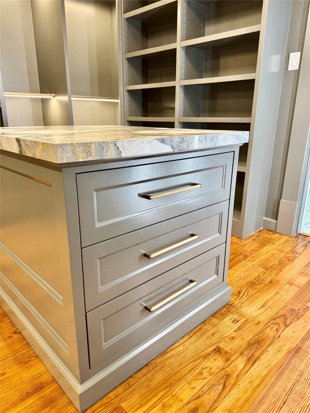 501 Avondale St, Houston, TX 77006 - detailed view of gray cabinets, light countertops, and light wood-style floors