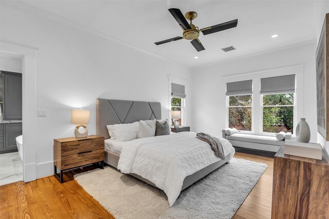 501 Avondale St, Houston, TX 77006 - bedroom featuring crown molding, light wood finished floors, ceiling fan, recessed lighting, and baseboards