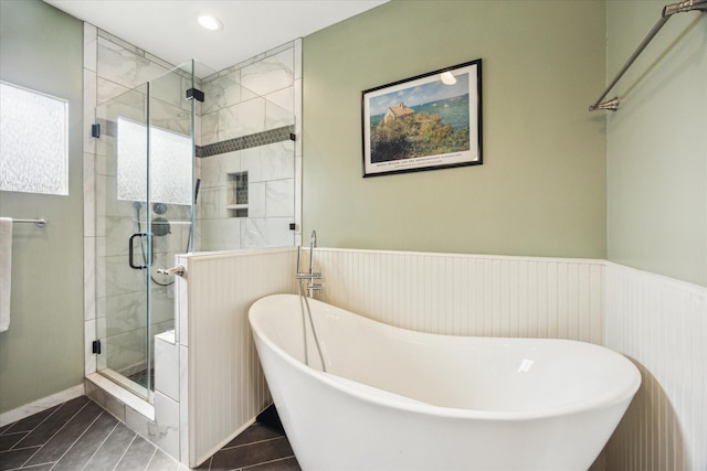 1128 W Temple St, Houston, TX 77009 - bathroom featuring a freestanding bath, a shower stall, a wainscoted wall, recessed lighting, and tile patterned floors