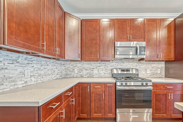 503 E 40th 1/2 St Unit A, Houston, TX 77022 - kitchen with stainless steel appliances and tasteful backsplash