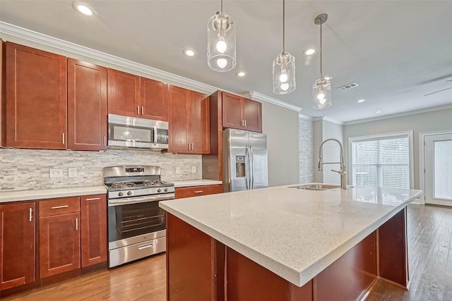 503 E 40th 1/2 St Unit A, Houston, TX 77022 - kitchen with appliances with stainless steel finishes, a sink, ornamental molding, wood finished floors, and decorative backsplash