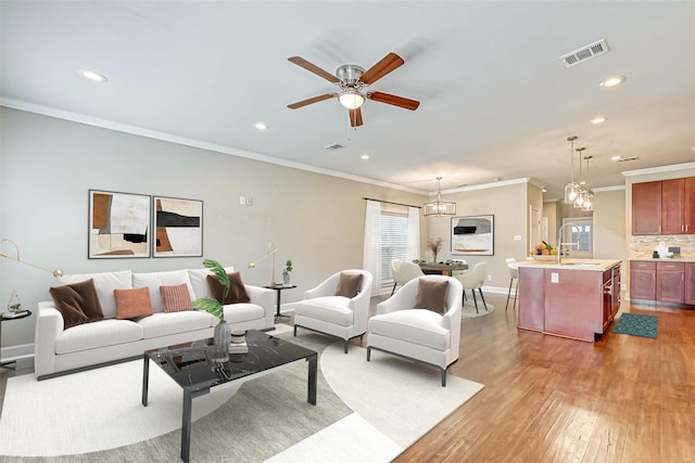 503 E 40th 1/2 St Unit A, Houston, TX 77022 - living area with recessed lighting, ornamental molding, wood finished floors, baseboards, and ceiling fan