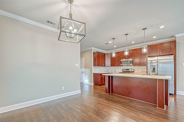 503 E 40th 1/2 St Unit A, Houston, TX 77022 - kitchen with stainless steel appliances, crown molding, light countertops, backsplash, and a chandelier