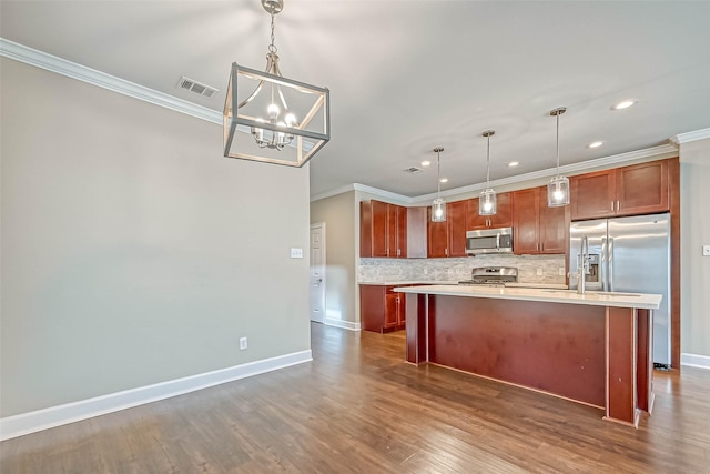 503 E 40th 1/2 St Unit A, Houston, TX 77022 - kitchen with stainless steel appliances, crown molding, light countertops, backsplash, and a chandelier