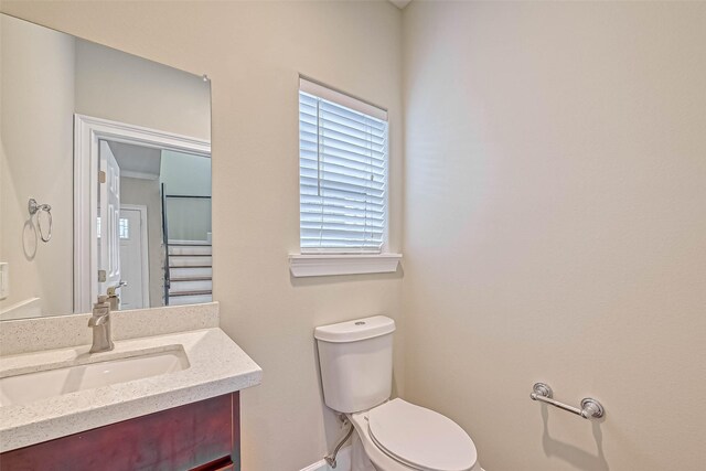 503 E 40th 1/2 St Unit A, Houston, TX 77022 - half bathroom featuring toilet, vanity, and baseboards