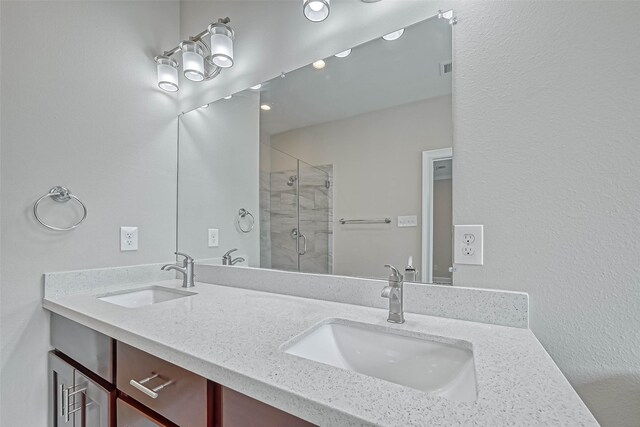 503 E 40th 1/2 St Unit A, Houston, TX 77022 - full bathroom featuring a stall shower and double vanity