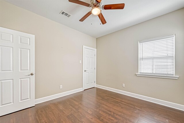 503 E 40th 1/2 St Unit A, Houston, TX 77022 - unfurnished bedroom featuring wood finished floors, baseboards, and ceiling fan