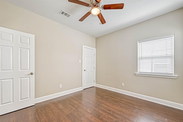 503 E 40th 1/2 St Unit A, Houston, TX 77022 - unfurnished bedroom featuring wood finished floors, baseboards, and ceiling fan