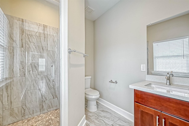 503 E 40th 1/2 St Unit A, Houston, TX 77022 - full bath featuring vanity, toilet, marble look tile flooring, tiled shower, and baseboards