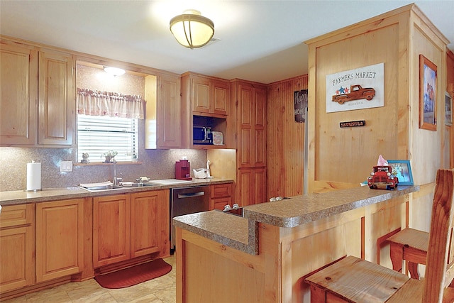 1321 Pickney Ave, Port Bolivar, TX 77650 - kitchen with appliances with stainless steel finishes, a peninsula, backsplash, a kitchen breakfast bar, and a sink