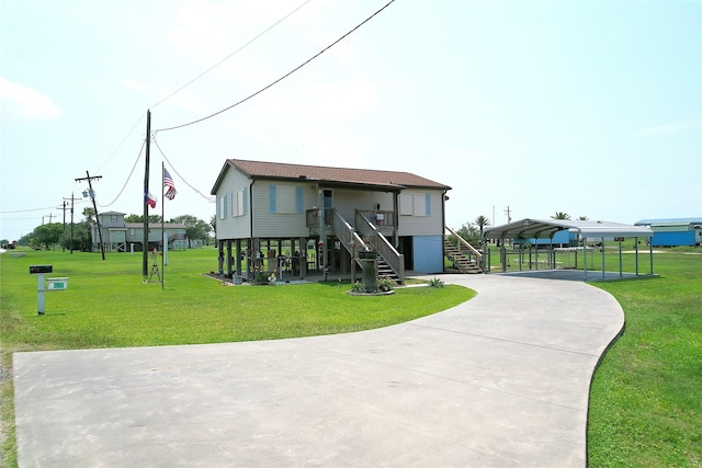 1321 Pickney Ave, Port Bolivar, TX 77650 - view of outdoor structure with stairway, concrete driveway, and a detached carport