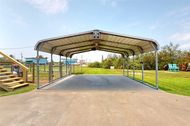 1321 Pickney Ave, Port Bolivar, TX 77650 - view of parking / parking lot with concrete driveway, a detached carport, and stairway