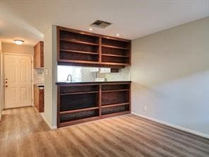 1205 Autrey St Unit 11, Houston, TX 77006 - bar with wood finished floors, baseboards, and recessed lighting