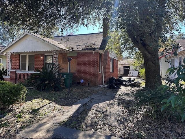 3016 Gray St, Houston, TX 77004 - view of side of home with brick siding and a chimney
