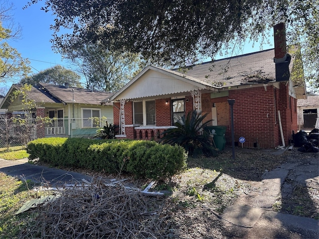 3016 Gray St, Houston, TX 77004 - view of front of house featuring brick siding, a chimney, and covered porch