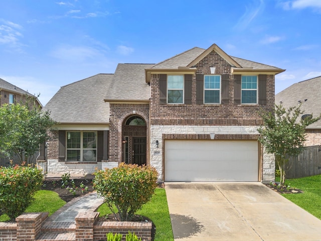 18719 Big Elm Dr, Cypress, TX 77433 - view of front of property featuring brick siding, an attached garage, concrete driveway, and a shingled roof
