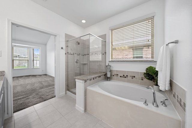18719 Big Elm Dr, Cypress, TX 77433 - bathroom featuring a bath, a stall shower, tile patterned floors, and recessed lighting
