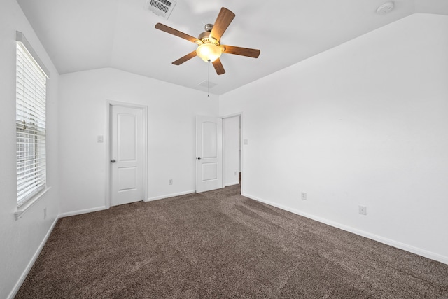 18719 Big Elm Dr, Cypress, TX 77433 - unfurnished bedroom with vaulted ceiling, dark colored carpet, baseboards, and a ceiling fan