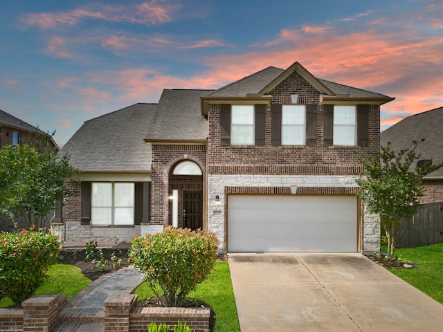 18719 Big Elm Dr, Cypress, TX 77433 - view of front of home with brick siding, concrete driveway, an attached garage, and a shingled roof