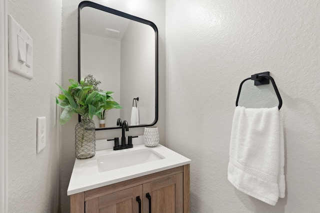 18719 Big Elm Dr, Cypress, TX 77433 - bathroom featuring vanity and a textured wall