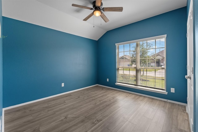 323 Jewett Meadow Dr, Magnolia, TX 77354 - empty room with a ceiling fan, wood finished floors, lofted ceiling, and baseboards