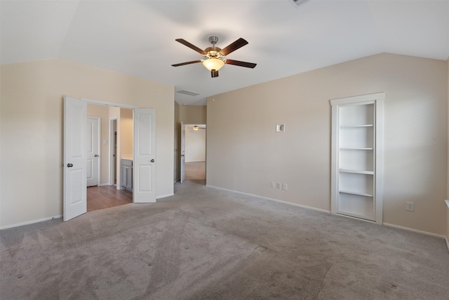 323 Jewett Meadow Dr, Magnolia, TX 77354 - unfurnished bedroom featuring carpet flooring, vaulted ceiling, baseboards, and a ceiling fan